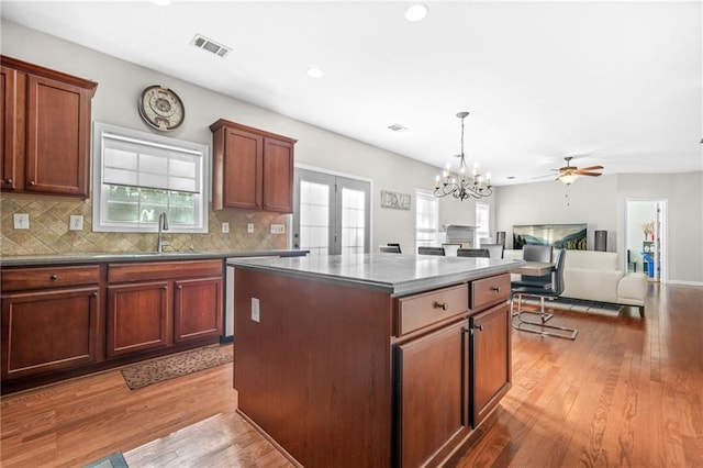 2625 Blackstock Dr, Cumming, GA 30041 - kitchen featuring recessed lighting, visible vents, a sink, a kitchen island, and decorative backsplash