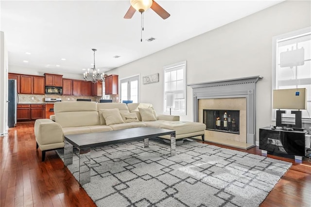 2625 Blackstock Dr, Cumming, GA 30041 - living area with recessed lighting, hardwood / wood-style floors, visible vents, a premium fireplace, and ceiling fan with notable chandelier