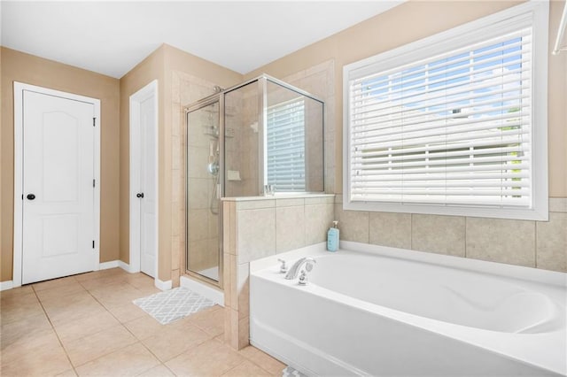 2625 Blackstock Dr, Cumming, GA 30041 - bathroom featuring baseboards, a garden tub, tile patterned floors, and a stall shower
