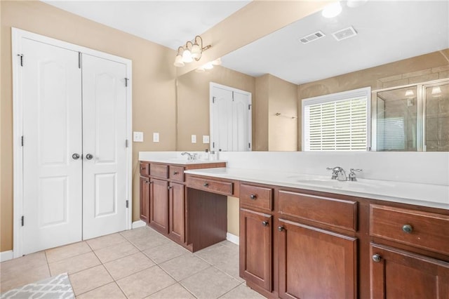 2625 Blackstock Dr, Cumming, GA 30041 - full bathroom featuring tile patterned floors, a sink, double vanity, a stall shower, and visible vents