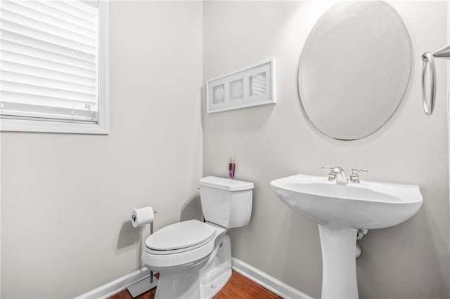 2625 Blackstock Dr, Cumming, GA 30041 - bathroom featuring baseboards, toilet, wood finished floors, and a sink