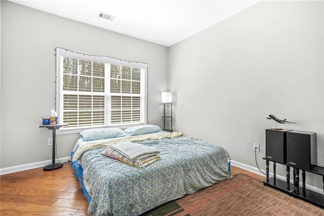 2625 Blackstock Dr, Cumming, GA 30041 - bedroom with baseboards, wood finished floors, and visible vents