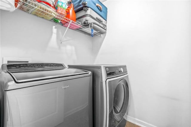 2625 Blackstock Dr, Cumming, GA 30041 - laundry area featuring washing machine and clothes dryer, baseboards, and laundry area