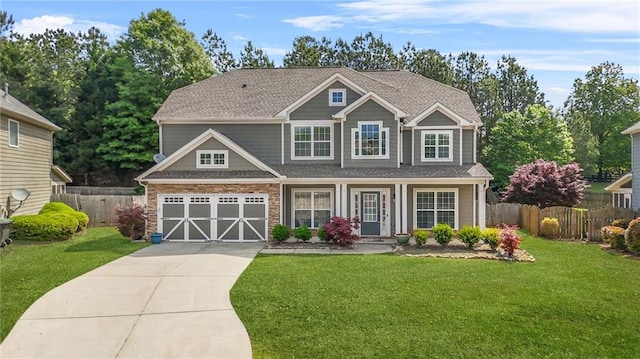 2625 Blackstock Dr, Cumming, GA 30041 - craftsman-style home with fence, driveway, a front yard, and a garage
