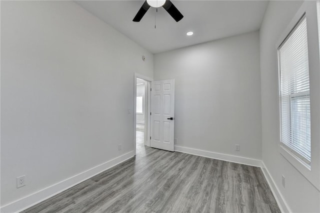 543 Paines Ave NW, Atlanta, GA 30318 - spare room with ceiling fan, light wood finished floors, and baseboards
