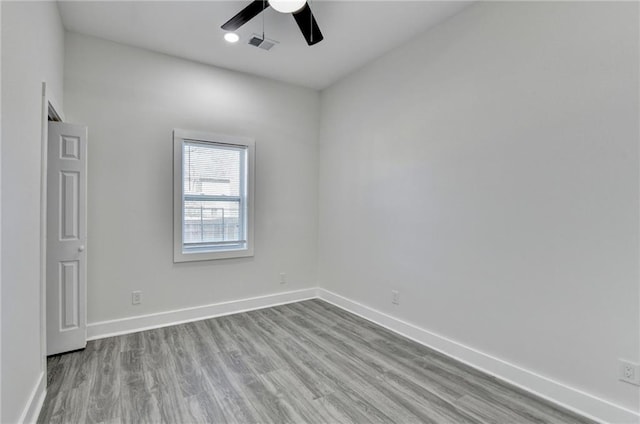 543 Paines Ave NW, Atlanta, GA 30318 - empty room with ceiling fan, light wood-type flooring, visible vents, and baseboards