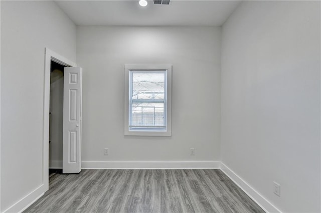 543 Paines Ave NW, Atlanta, GA 30318 - empty room featuring light wood-type flooring, visible vents, and baseboards