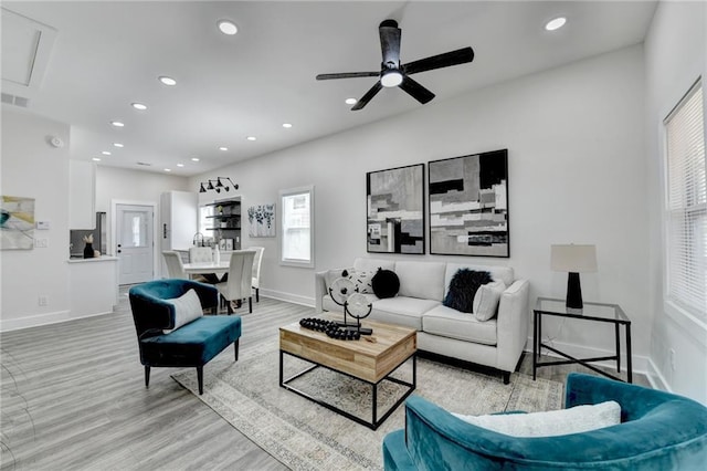 543 Paines Ave NW, Atlanta, GA 30318 - living room featuring light wood-style flooring, baseboards, a ceiling fan, and recessed lighting