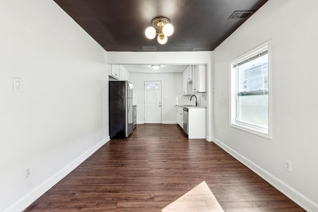 interior space featuring dark hardwood / wood-style flooring and sink