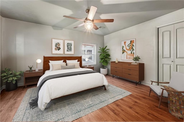 bedroom featuring ceiling fan and hardwood / wood-style floors