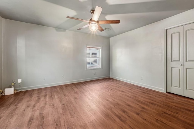 spare room featuring ceiling fan and light wood-type flooring