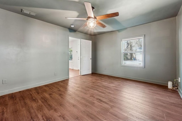 unfurnished bedroom featuring hardwood / wood-style floors and ceiling fan