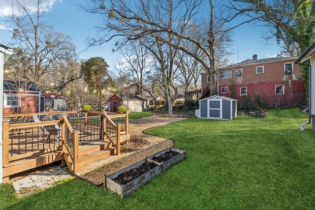 view of yard featuring a wooden deck and a storage shed