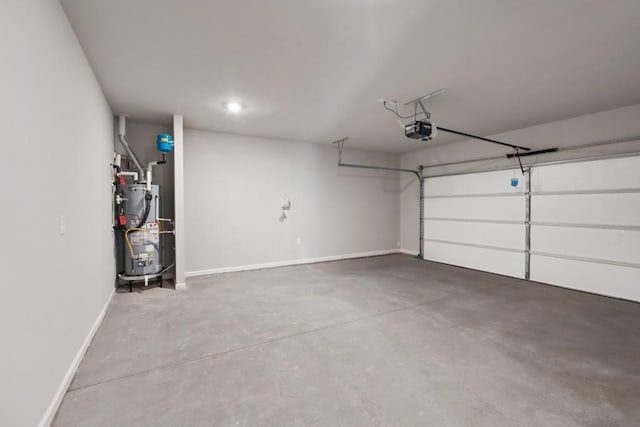 garage featuring gas water heater and a garage door opener