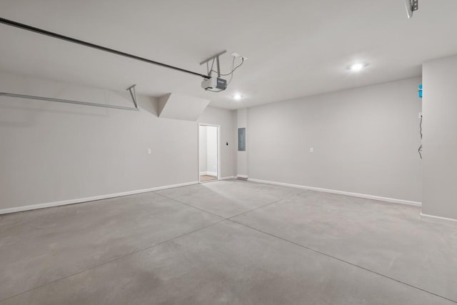 garage with electric panel and a garage door opener