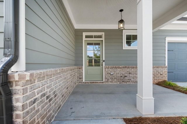 doorway to property with a garage