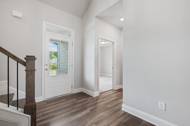 entryway with dark wood-type flooring