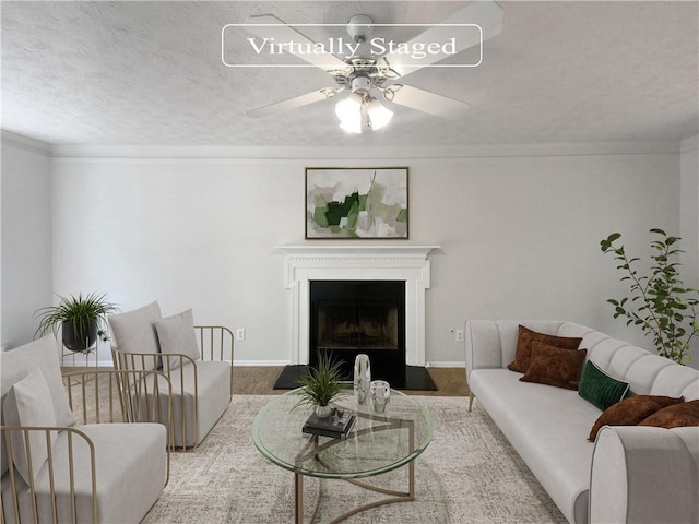 living room featuring ornamental molding and ceiling fan