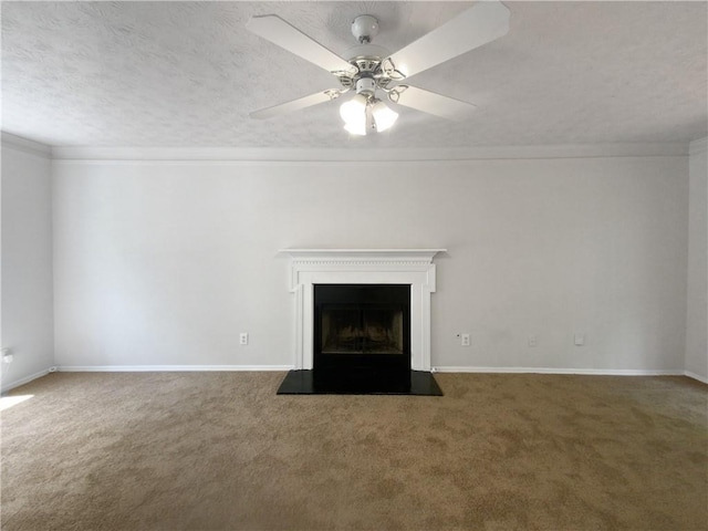 unfurnished living room with ceiling fan, crown molding, and dark carpet