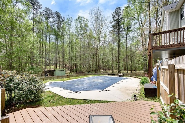 1772 Brittany Chase NW, Kennesaw, GA 30152 - view of pool with a wooden deck, a fenced backyard, a patio area, and a view of trees