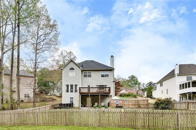 1772 Brittany Chase NW, Kennesaw, GA 30152 - rear view of house featuring a wooden deck, a chimney, and a residential view