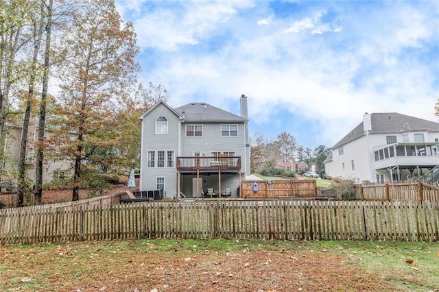 1772 Brittany Chase NW, Kennesaw, GA 30152 - rear view of property featuring a chimney, a fenced backyard, and a wooden deck