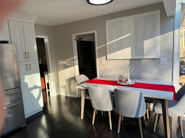 dining room featuring dark hardwood / wood-style flooring