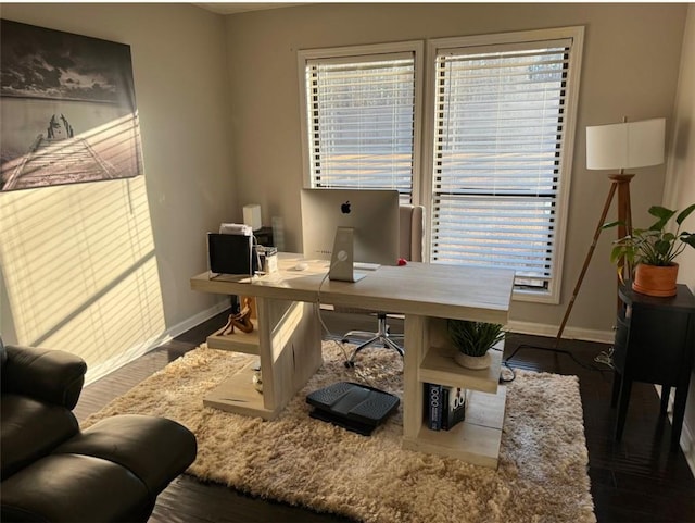 office with dark hardwood / wood-style flooring