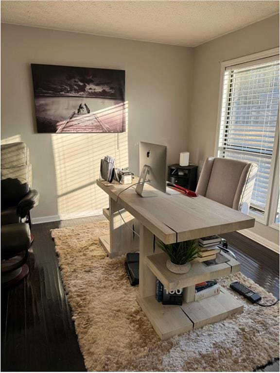 office space with hardwood / wood-style flooring and a textured ceiling