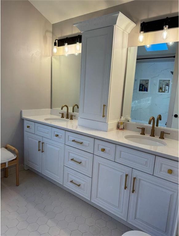 bathroom with vanity and tile patterned flooring