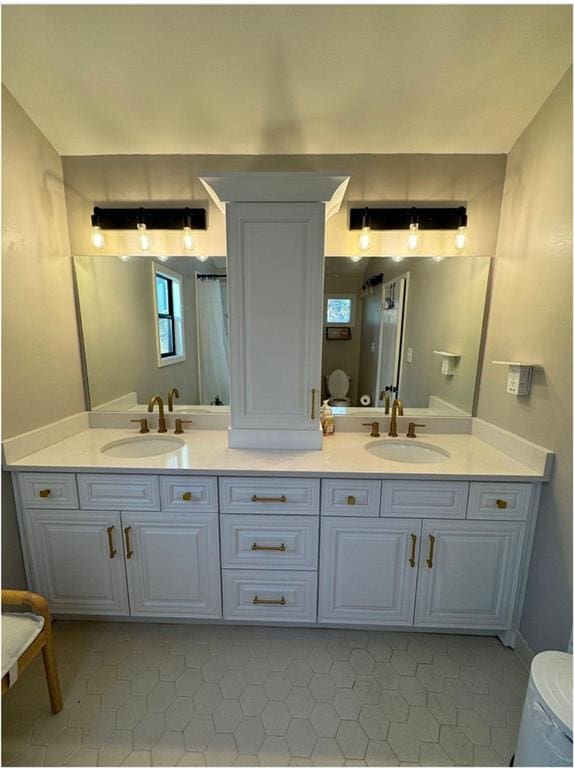 bathroom with vanity and tile patterned flooring