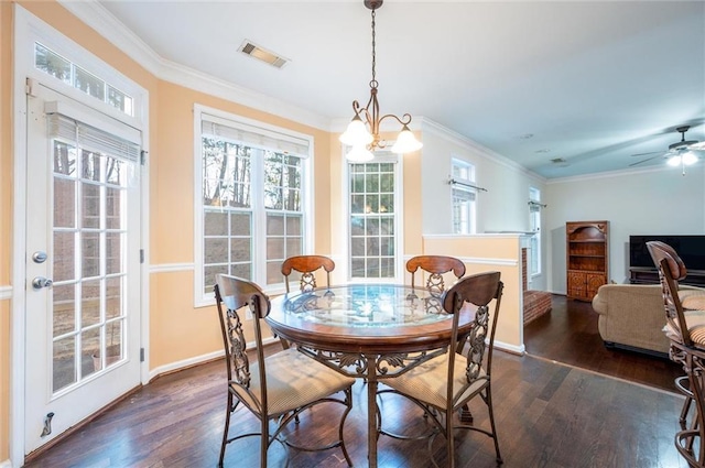 dining room featuring dark wood-style flooring, visible vents, and crown molding