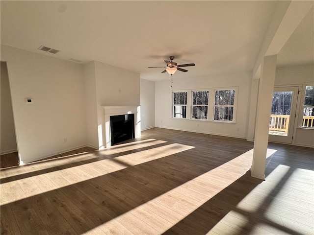 unfurnished living room featuring ceiling fan and light hardwood / wood-style flooring