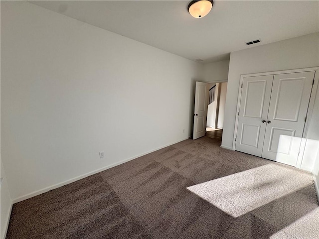 carpeted bedroom with a closet