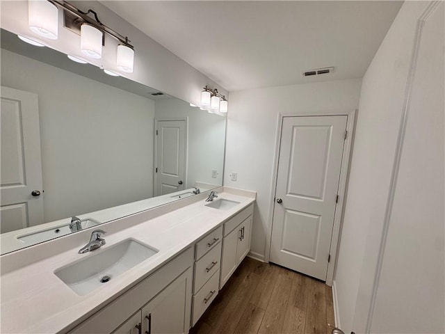 bathroom featuring hardwood / wood-style floors and vanity