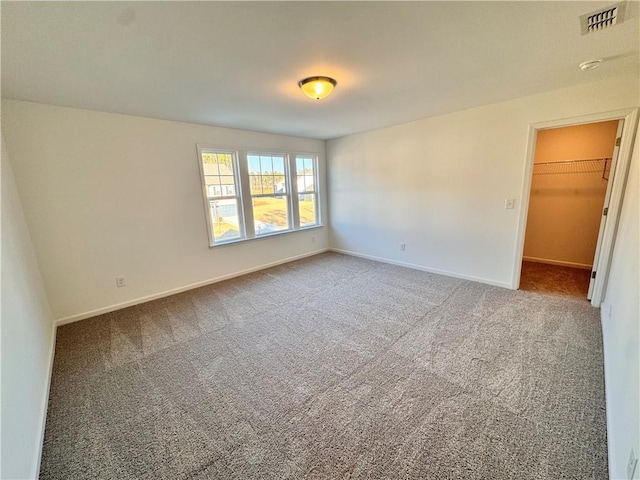 unfurnished room featuring carpet flooring