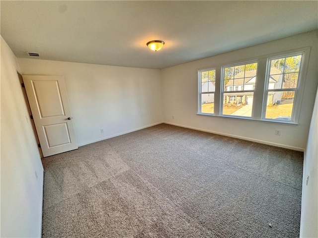 view of carpeted spare room