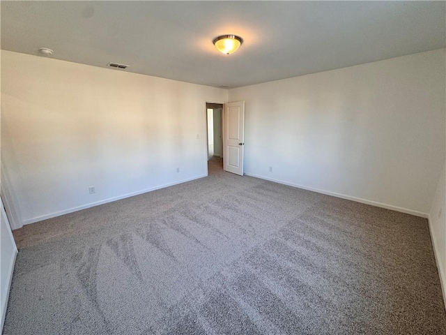 unfurnished room featuring carpet flooring