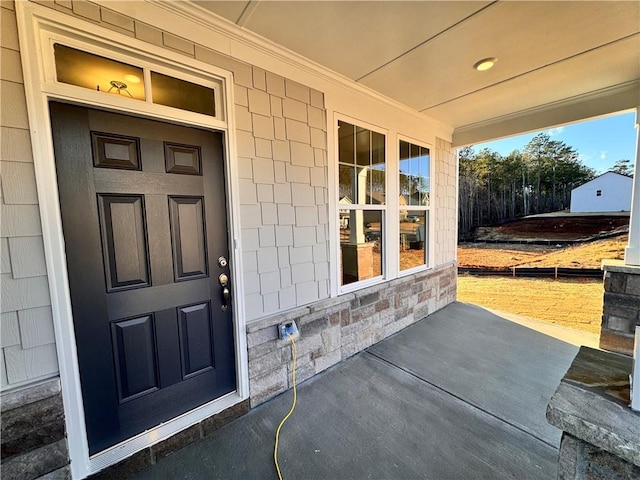 property entrance featuring a porch