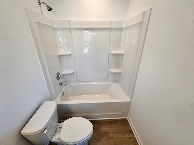 bathroom with wood-type flooring, toilet, and shower / bathtub combination