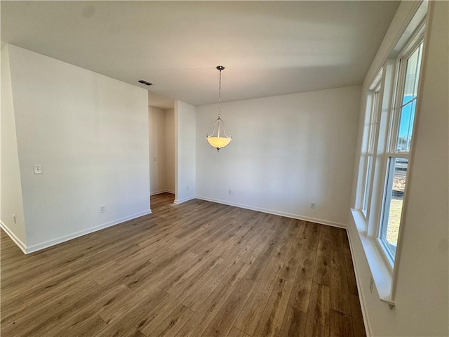 empty room featuring wood-type flooring