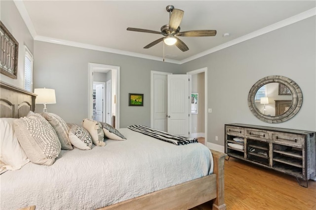 2434 Soft Maple St, Atlanta, GA 30360 - bedroom featuring wood finished floors, crown molding, baseboards, and ceiling fan
