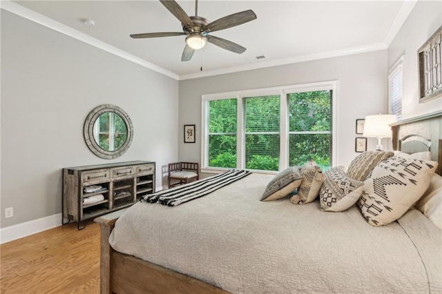 2434 Soft Maple St, Atlanta, GA 30360 - bedroom with multiple windows, light wood-type flooring, crown molding, baseboards, and a ceiling fan