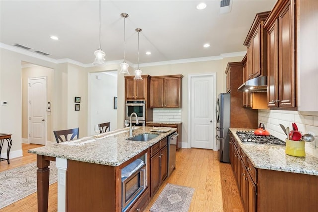 2434 Soft Maple St, Atlanta, GA 30360 - kitchen with a sink, appliances with stainless steel finishes, a breakfast bar area, under cabinet range hood, and backsplash