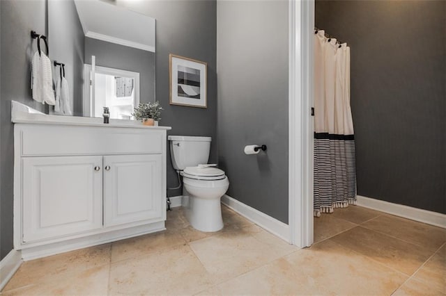 bathroom featuring vanity, tile patterned floors, and toilet