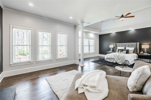 bedroom featuring dark hardwood / wood-style flooring, crown molding, decorative columns, and ceiling fan