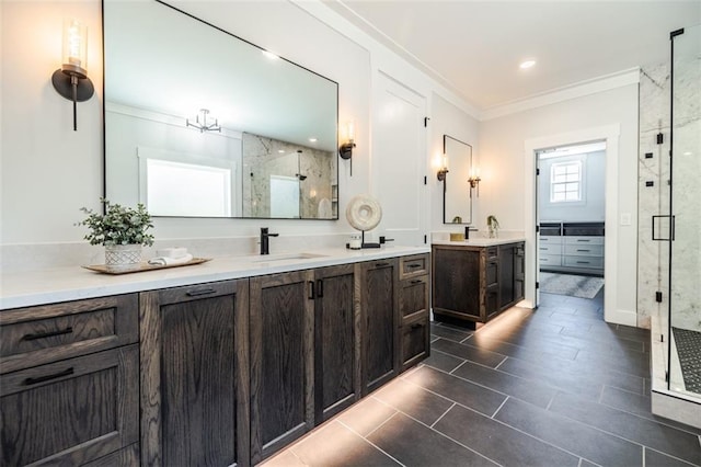 bathroom featuring crown molding, vanity, and an enclosed shower