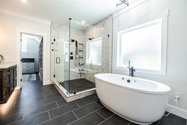 bathroom with vanity, plenty of natural light, tile patterned floors, and separate shower and tub