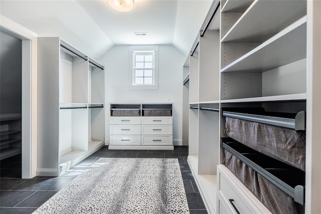 spacious closet featuring vaulted ceiling