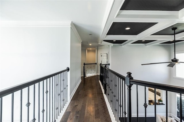 corridor with beamed ceiling, crown molding, coffered ceiling, and dark hardwood / wood-style flooring